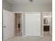 Bright bedroom with double doors leading to a bathroom and additional room at 1722 Farmstead Ln, Oviedo, FL 32765