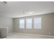 Spacious bonus room with three windows and neutral walls at 1722 Farmstead Ln, Oviedo, FL 32765