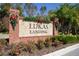 Community entrance sign for Lukas Landing with holiday decor at 1722 Farmstead Ln, Oviedo, FL 32765