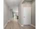 View down a long hallway showcasing tile flooring at 1722 Farmstead Ln, Oviedo, FL 32765