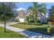 Single-story house with a two-car garage and nicely landscaped yard at 1722 Farmstead Ln, Oviedo, FL 32765