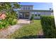 Two-story house with screened patio, landscaping, and brick accents at 1722 Farmstead Ln, Oviedo, FL 32765