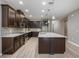 Modern kitchen with dark wood cabinets and a large island at 1722 Farmstead Ln, Oviedo, FL 32765