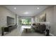 Living room with modern furnishings and view of backyard at 1722 Farmstead Ln, Oviedo, FL 32765