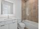 Modern bathroom with white vanity, bathtub and a walk-in shower at 1778 Mondrian Cir, Winter Park, FL 32789