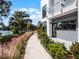 Modern townhome with walkway leading to lake at 1778 Mondrian Cir, Winter Park, FL 32789