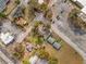 Birds-eye view of a residential property near a commercial area, showcasing its location and surrounding neighborhood at 201 N East St, Leesburg, FL 34748