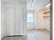 Versatile bonus room with a large closet, bright window, and additional shelving space for storage at 201 N East St, Leesburg, FL 34748