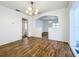 Dining room features wood-look floors and white walls, with open view to other rooms at 201 N East St, Leesburg, FL 34748