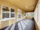 Charming sunroom with many windows to capture the natural light and views at 201 N East St, Leesburg, FL 34748