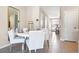 Bright dining room with white table and chairs, near entryway at 2195 Longleaf Rd, Davenport, FL 33837