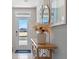 Bright entryway with console table, mirror, and pampas grass at 2203 Longleaf Rd, Davenport, FL 33837
