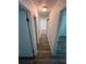 Clean hallway with wood-look floors and multiple doors at 2340 Hamilton St, Bartow, FL 33830