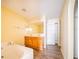 Bathroom with double vanity, tub, and linen closet at 266 Vervain Ave, Davenport, FL 33837