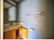 Clean bathroom with single sink, wood cabinet, and toilet at 266 Vervain Ave, Davenport, FL 33837