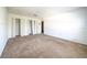 Empty bedroom with double door closets and neutral decor at 266 Vervain Ave, Davenport, FL 33837