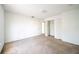 Simple bedroom with carpet flooring and a double door closet at 266 Vervain Ave, Davenport, FL 33837