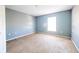 Bright bedroom featuring neutral walls and carpet flooring at 266 Vervain Ave, Davenport, FL 33837