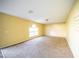 Spacious living room with large window and neutral wall colors at 266 Vervain Ave, Davenport, FL 33837