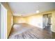 Spacious living room with carpet and view into kitchen at 266 Vervain Ave, Davenport, FL 33837