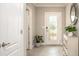 Inviting foyer featuring a decorative door and neutral color palette at 2903 Travelers Palm Dr, Edgewater, FL 32141