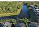 Aerial view of homes and canal, highlighting the community's serene setting at 2981 Viscount Cir, Kissimmee, FL 34747