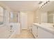 Bright bathroom with double vanity, shower, and bathtub at 2981 Viscount Cir, Kissimmee, FL 34747