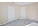 Spacious bedroom with gray carpet and double door closet at 2981 Viscount Cir, Kissimmee, FL 34747