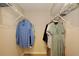 This walk in closet features shelving with hanging rods, providing storage space for clothing at 2981 Viscount Cir, Kissimmee, FL 34747