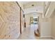 Open floor plan with a large barn door and staircase at 2981 Viscount Cir, Kissimmee, FL 34747