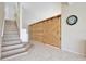 Open foyer features staircase and a decorative sliding wood door at 2981 Viscount Cir, Kissimmee, FL 34747