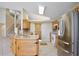 Kitchen features stainless steel appliances and access to the stairway at 2981 Viscount Cir, Kissimmee, FL 34747