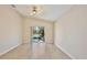 Bright living room with sliding glass doors leading to the pool at 2981 Viscount Cir, Kissimmee, FL 34747