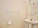 Compact powder room features a pedestal sink at 2981 Viscount Cir, Kissimmee, FL 34747