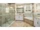 Elegant bathroom with double sinks, a shower, and a soaking tub at 31921 Redtail Reserve Blvd, Sorrento, FL 32776