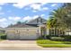 Two-story house with three-car garage and landscaping at 31921 Redtail Reserve Blvd, Sorrento, FL 32776