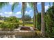 Landscaped backyard with fire pit and scenic views at 31921 Redtail Reserve Blvd, Sorrento, FL 32776