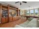 Game room with pool table, bar and entertainment center at 31921 Redtail Reserve Blvd, Sorrento, FL 32776