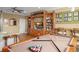 Game room with pool table and entertainment center at 31921 Redtail Reserve Blvd, Sorrento, FL 32776
