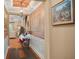 Elegant entryway with hardwood floors, decorative wall and recessed lighting at 31921 Redtail Reserve Blvd, Sorrento, FL 32776