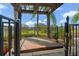 Covered hot tub with a pergola, offering privacy and scenic views at 31921 Redtail Reserve Blvd, Sorrento, FL 32776