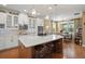Modern kitchen with white cabinets, large island, and stainless steel appliances at 31921 Redtail Reserve Blvd, Sorrento, FL 32776