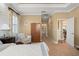 Main bedroom features access to the bathroom and hallway at 31921 Redtail Reserve Blvd, Sorrento, FL 32776