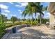 Spacious paved patio with lush landscaping and golf course views at 31921 Redtail Reserve Blvd, Sorrento, FL 32776