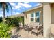 Outdoor patio furniture and seating area adjacent to the house at 31921 Redtail Reserve Blvd, Sorrento, FL 32776