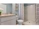 Clean bathroom with a shower/tub combo, vanity, and neutral color scheme at 3428 Costello Cir, Winter Haven, FL 33884