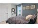 Bedroom with a dresser, full bed, and blue accent wall at 3428 Costello Cir, Winter Haven, FL 33884