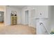 Upstairs hallway with neutral carpeting and linen cabinet at 3428 Costello Cir, Winter Haven, FL 33884