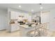 White kitchen with stainless steel appliances and an island at 3428 Costello Cir, Winter Haven, FL 33884