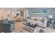 Living room with light beige couch and patterned armchairs at 3428 Costello Cir, Winter Haven, FL 33884